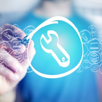 advanced system repair tool review system optimizers man touching screen wrench symbol on 